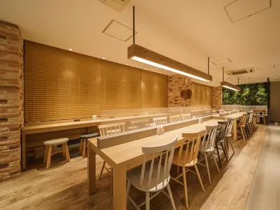 a long dining room with tables and chairs at Super Hotel Tokyo JR Kamata Nishiguchi in Tokyo