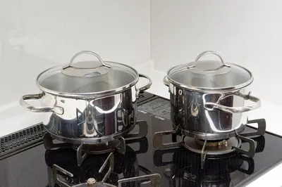 two pots sitting on top of a stove at Zuzu & Gizmo in Tokyo