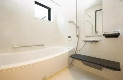 a bathroom with a bath tub and a sink at Zuzu & Gizmo in Tokyo