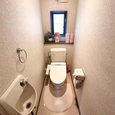 a small bathroom with a toilet and a sink at ookubo hills Unique 3 Bedroom House in Shinjuku area in Tokyo