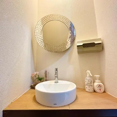 a bathroom sink with a mirror on a counter at ookubo hills Room for 1 located in Shinjuku area in Tokyo
