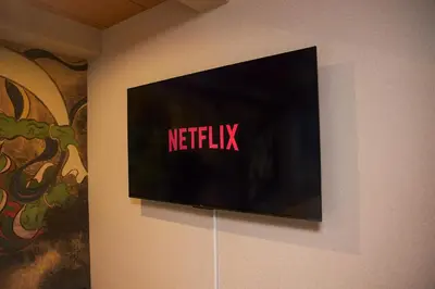 a television on a wall with the netflix sign on it at Asakusa Premium Stay \u5f69-Irodori- in Tokyo