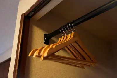 a bunch of wooden baseballoons hanging from a rack at Asakusa Premium Stay \u5f69-Irodori- in Tokyo