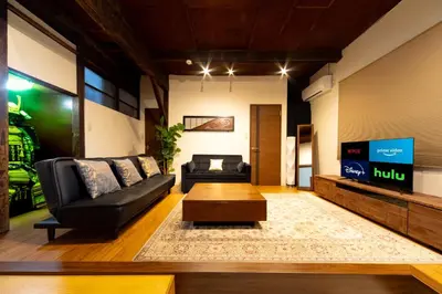 a living room with a couch and a coffee table at The Guest House Nagomi in Tokyo