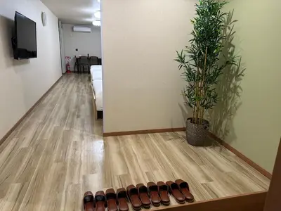 a row of shoes on the floor in a room at \u6d77\u5bb9\u7acb\u77f3 in Tokyo