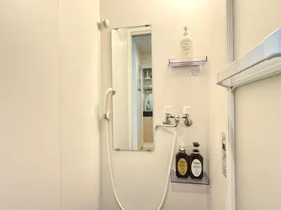 a bathroom with a shower with a mirror at Shinjuku Cloudlive AE AF in Tokyo