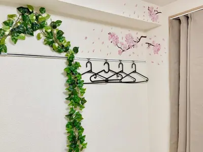 a ivy growing on a metal rack in a room at Shinjuku Cloudlive AE AF in Tokyo