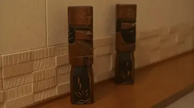 two robots are standing on a basketball court at Lucky house west Kitasenju in Tokyo