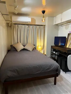 a bedroom with a bed and a desk at SHINJUKU station 10min by walk! KB House in Tokyo