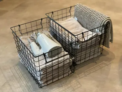 a wire basket with a toilet in it at COTO Shibuya Premium Garden in Tokyo