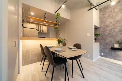 a dining room with a table and chairs at Eims stay Ikebukuro in Tokyo