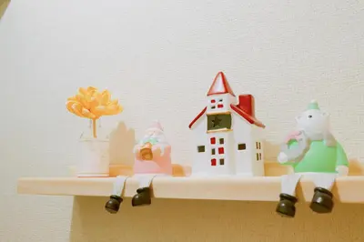 a shelf with some toy figurines on it at F-Mansion209 in Tokyo