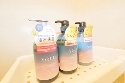 three bottles of soap sitting on a shelf at F-Mansion209 in Tokyo
