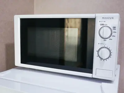 a microwave oven sitting on top of a counter at MSTAY\u6771\u6c60\u888bone in Tokyo