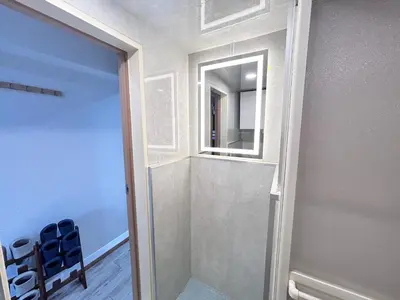 a bathroom with a glass shower with a mirror at Y-Shinjuku City, Okubo 3F-SJ0069 in Tokyo