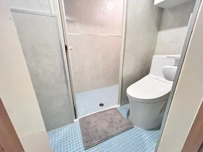 a small bathroom with a toilet and a shower at Y-Shinjuku City, Okubo 3F-SJ0069 in Tokyo