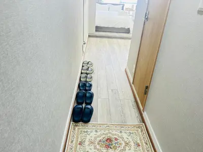 a hallway with blue spheres on the floor next to a door at Y-Shinjuku City, Okubo 3F-SJ0069 in Tokyo