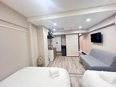 a small room with a bed and a couch at Y-Shinjuku City, Okubo 3F-SJ0069 in Tokyo