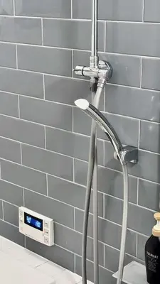 a shower head in a bathroom next to a wall at \u6e0b\u8c37\u9ad8\u7d1a\u4e00\u6238\u5efa\u3066 \u8cb8\u5207 \u30c6\u30e9\u30b9\u4ed8\u304d \u6700\u5927\u4e03\u540d in Tokyo