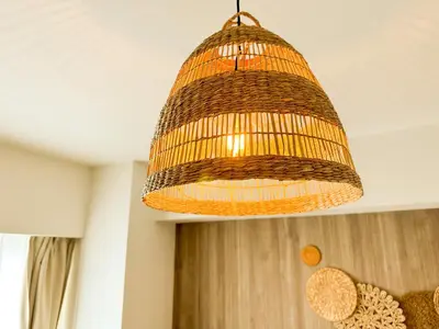 a wicker chandelier hanging from a ceiling at Syforme Keikyu-Kamata Residence in Tokyo