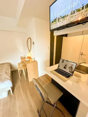 a room with a desk with a laptop on it at Syforme Keikyu-Kamata Residence in Tokyo