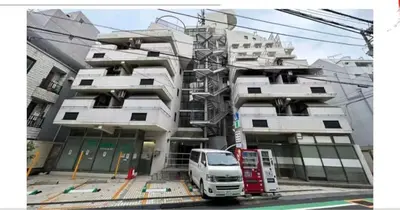 a white van parked in front of a building at 406Room,With elevator, 700m 4 min walk from Nishi-Shinjuku 5-chome, direct access to Shinjuku, 28 sqm in Tokyo