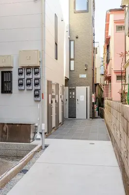 an empty alley in a city with buildings at ksf\u4e0a\u6c60\u888b3\u4e01\u76ee302 in Tokyo