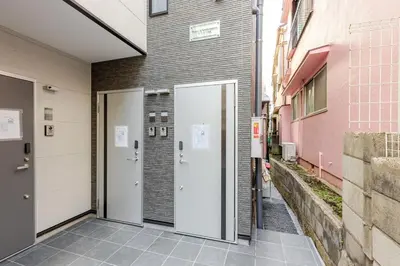 a building with a door in a alley at ksf\u4e0a\u6c60\u888b3\u4e01\u76ee302 in Tokyo