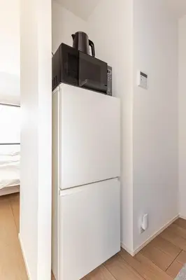 a white refrigerator with a microwave on top of it at ksf\u4e0a\u6c60\u888b3\u4e01\u76ee302 in Tokyo