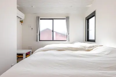 a white bed in a room with a window at ksf\u4e0a\u6c60\u888b3\u4e01\u76ee302 in Tokyo