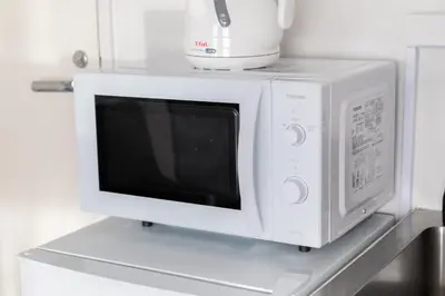 a microwave oven sitting on top of a shelf at feel Akihabara STAY in Tokyo