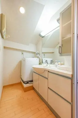 a kitchen with a sink and a refrigerator at Shinjuku 2 stops 3 bedrooms best groups or family in Tokyo