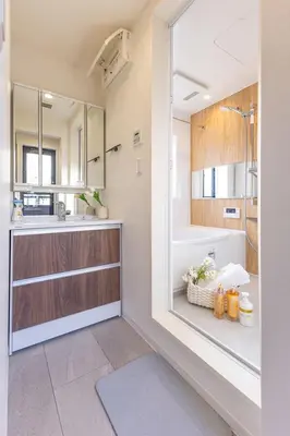 a bathroom with a sink and a tub and a mirror at ikebukuro three storey villa,three bedrooms,9-10 people in Tokyo