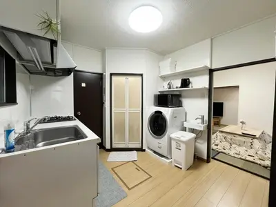 a kitchen with a sink and a washing machine at ksf\u6c60\u888b\u672c\u753a4\u4e01\u76ee in Tokyo