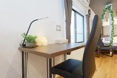 a desk with a chair in a room at Keiko House in Tokyo