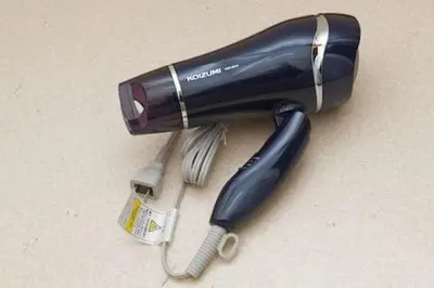 a hair dryer with a bottle and a whisk at Keiko House in Tokyo