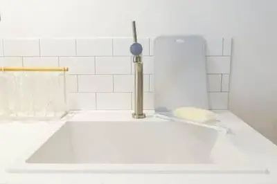 a bathroom with a sink with a faucet at Keiko House in Tokyo