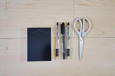 a pair of scissors and some pens on a table at Industrial room in Tokyo