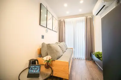 a living room with a couch and a table at \u30dc\u30eb\u30bf\u30e9\u6e0b\u8c37 in Tokyo