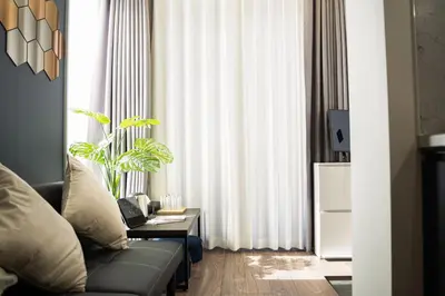 a living room with a couch and a table at \u30dc\u30eb\u30bf\u30e9\u6e0b\u8c37 in Tokyo