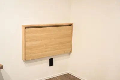 a wooden box on the wall of a white wall at \u30dc\u30eb\u30bf\u30e9\u6e0b\u8c37 in Tokyo