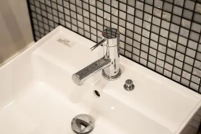 a bathroom sink with a faucet on top of it at \u30dc\u30eb\u30bf\u30e9\u6e0b\u8c37 in Tokyo