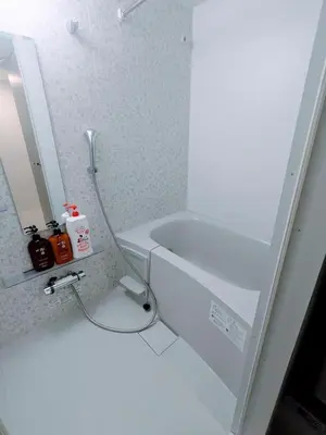 a white bathroom with a sink and a mirror at Ciel de Kagurazaka Familial iidabashi \u65b0\u5bbf\u795e\u697d\u5742\u98ef\u7530\u6a4b ## Shuttle, Ticket, Restaurant reservation service ## in Tokyo