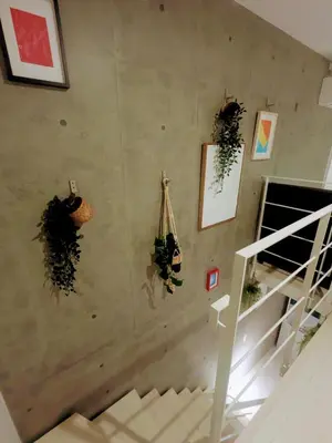 a staircase in a house with wreaths on the wall at Ciel de Kagurazaka Familial iidabashi \u65b0\u5bbf\u795e\u697d\u5742\u98ef\u7530\u6a4b ## Shuttle, Ticket, Restaurant reservation service ## in Tokyo