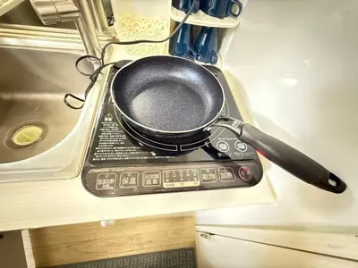 a frying pan sitting on top of a stove at ying-Shinjuku hostel-SJ0055 in Tokyo