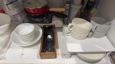 a kitchen counter with white cups and plates on it at ying-Shinjuku hostel-SJ0055 in Tokyo