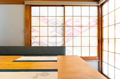 a desk in a room with a large window at The Guest House Sakura in Tokyo