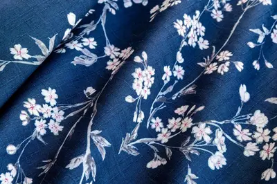 a blue dress with flowers on a blue cloth at The Guest House Sakura in Tokyo