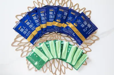 a bunch of blue and green packets of toilet paper at The Guest House Sakura in Tokyo