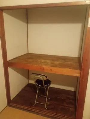 a wooden shelf with a chair underneath it at Edo Tokyo Sharehouse Long Stay Only, One month plus in Tokyo
